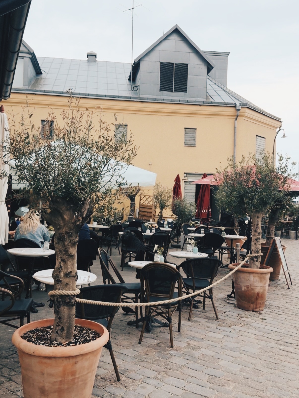 Guests gathered on the terrace of a Stockholm venue on a summer evening.